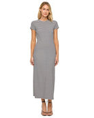 Woman wearing a black and white striped dress on a white background